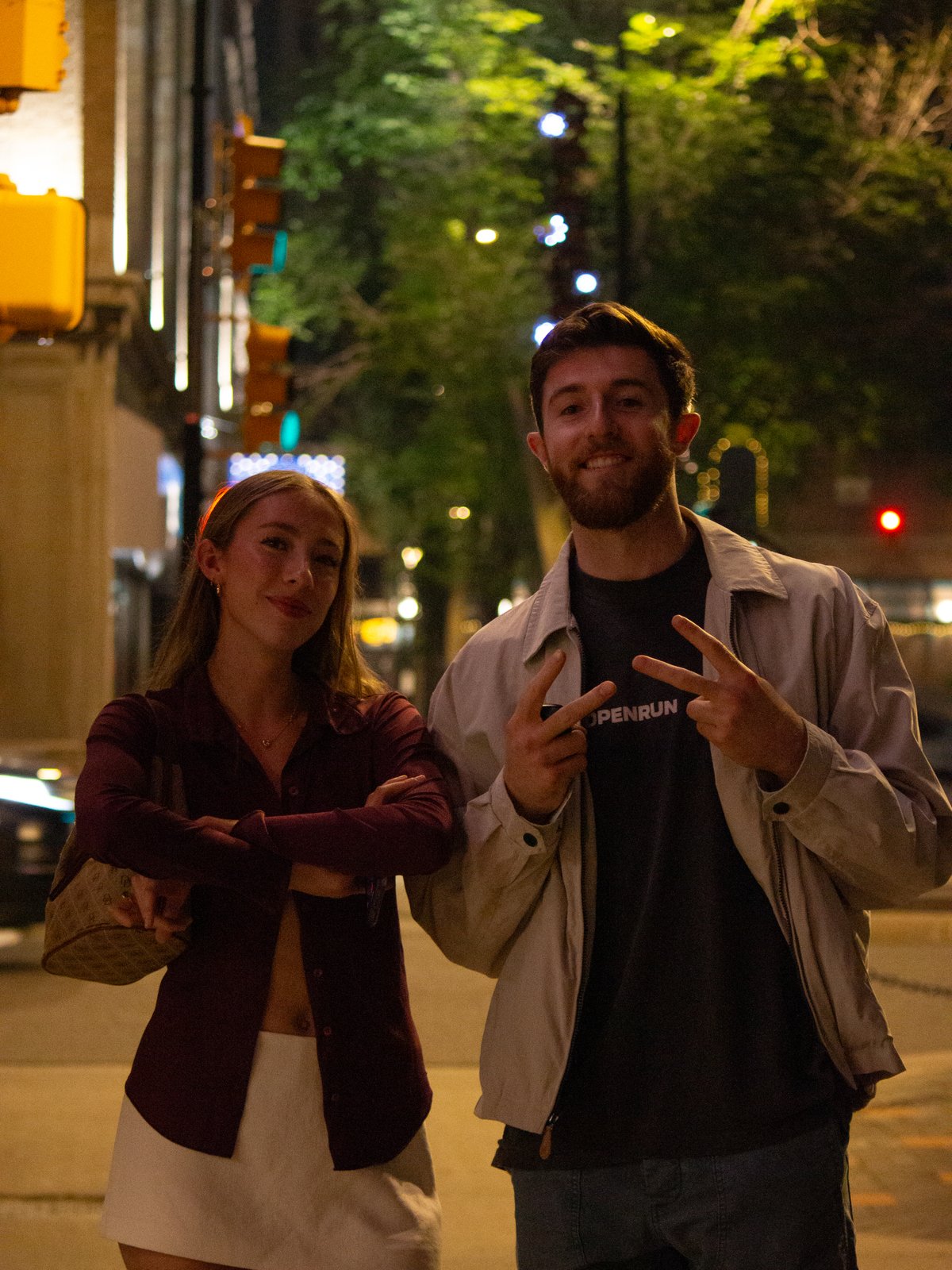 Couple on downtown Saskatoon street at night with bokeh lights